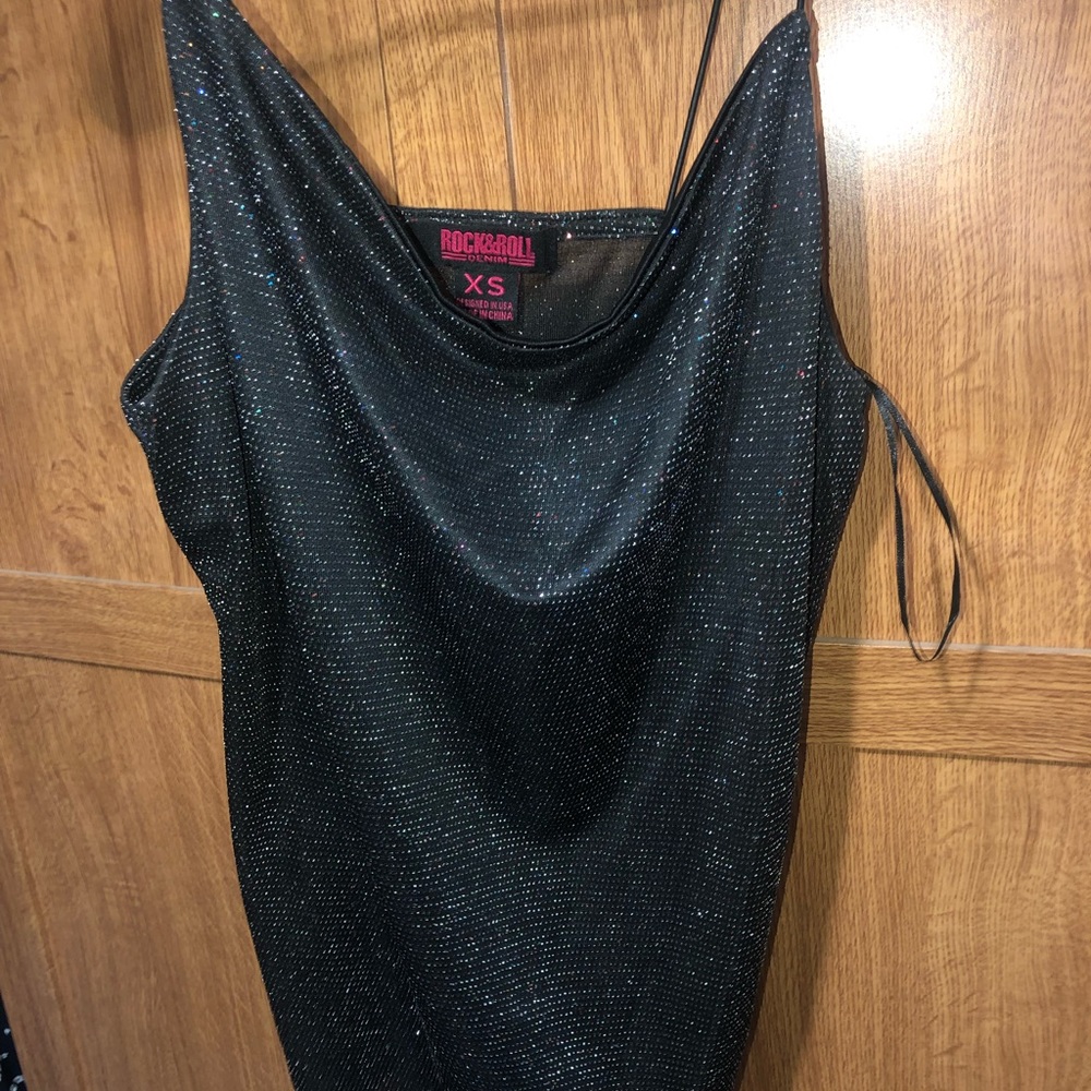 Rock n roll tank size xs but fits like a small or medium
